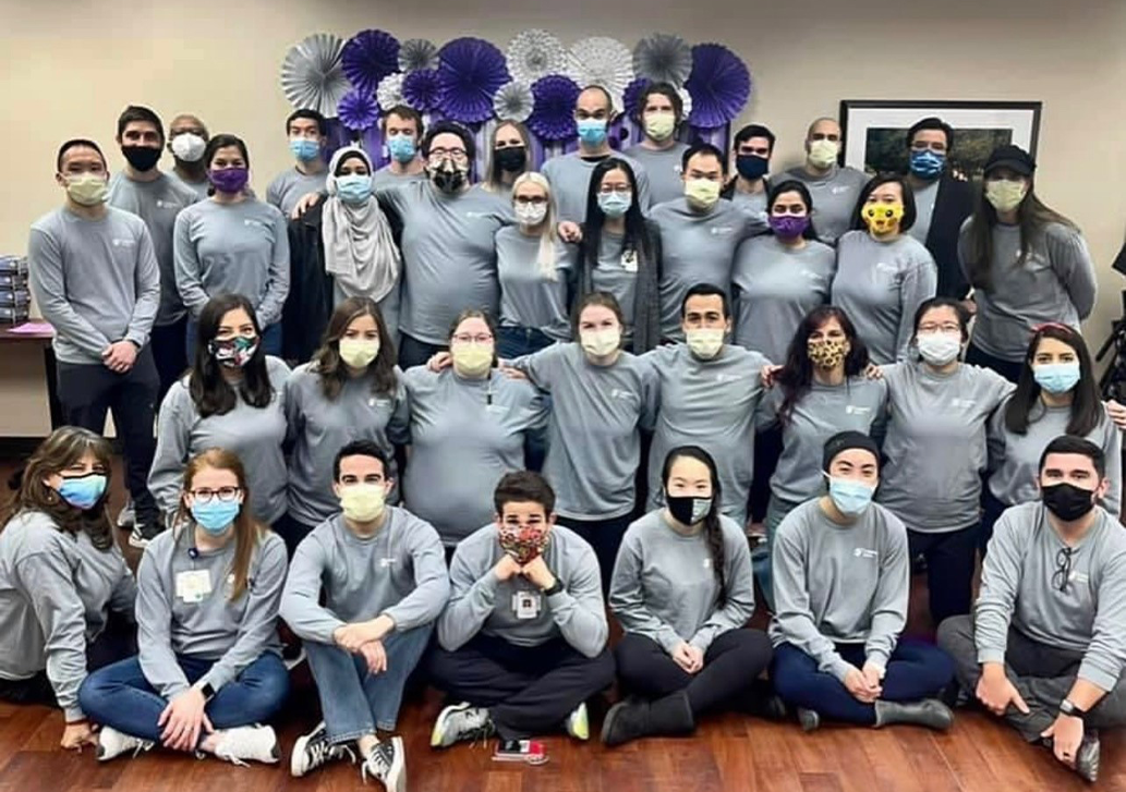 A large group of CHRISTUS Santa Rosa residents smiling for a group picture 