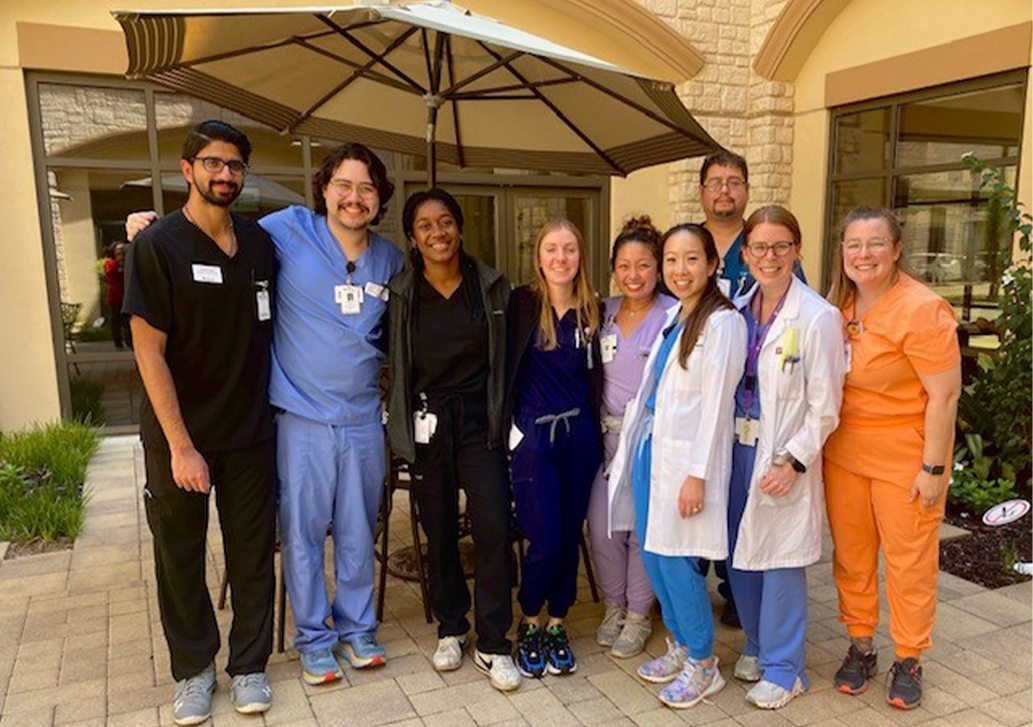 A group of residents smiling for the camera after lunch