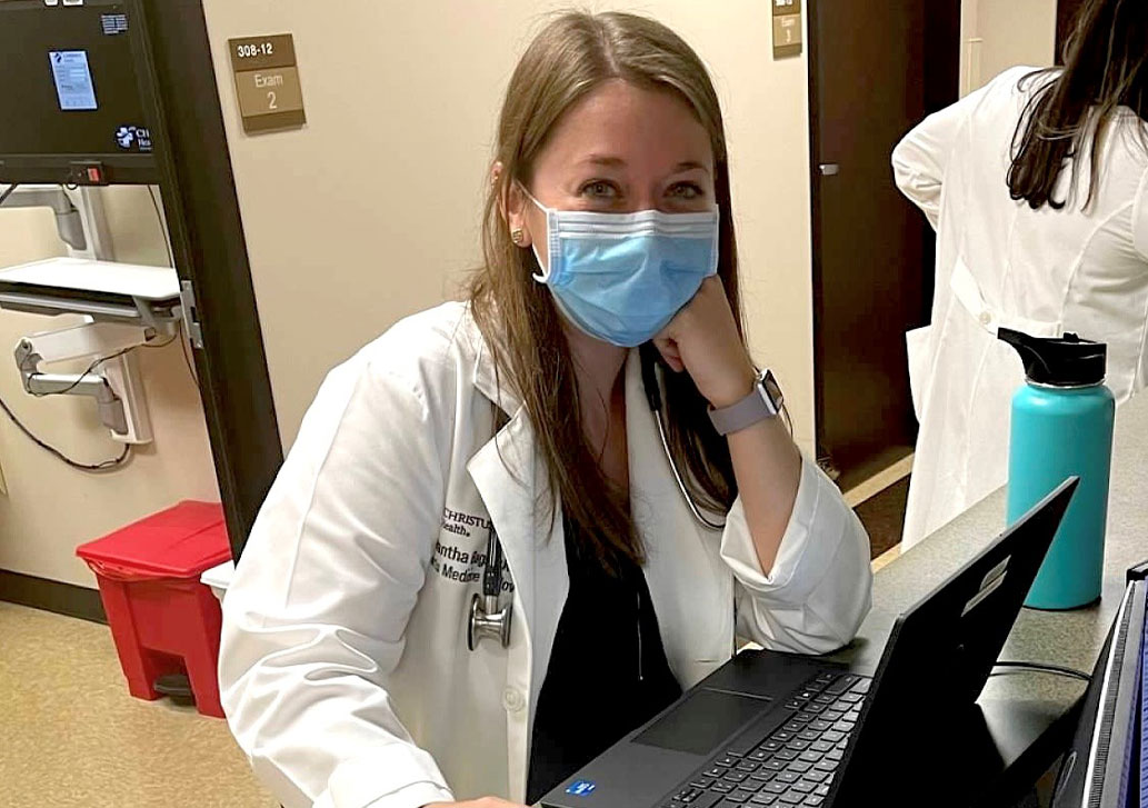 A resident smiling through her mask