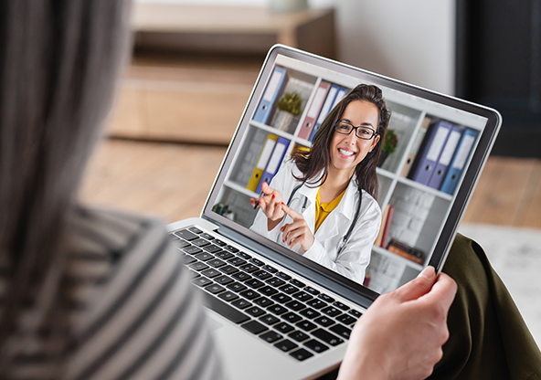 A elder woman receiving a virtual care appointment.